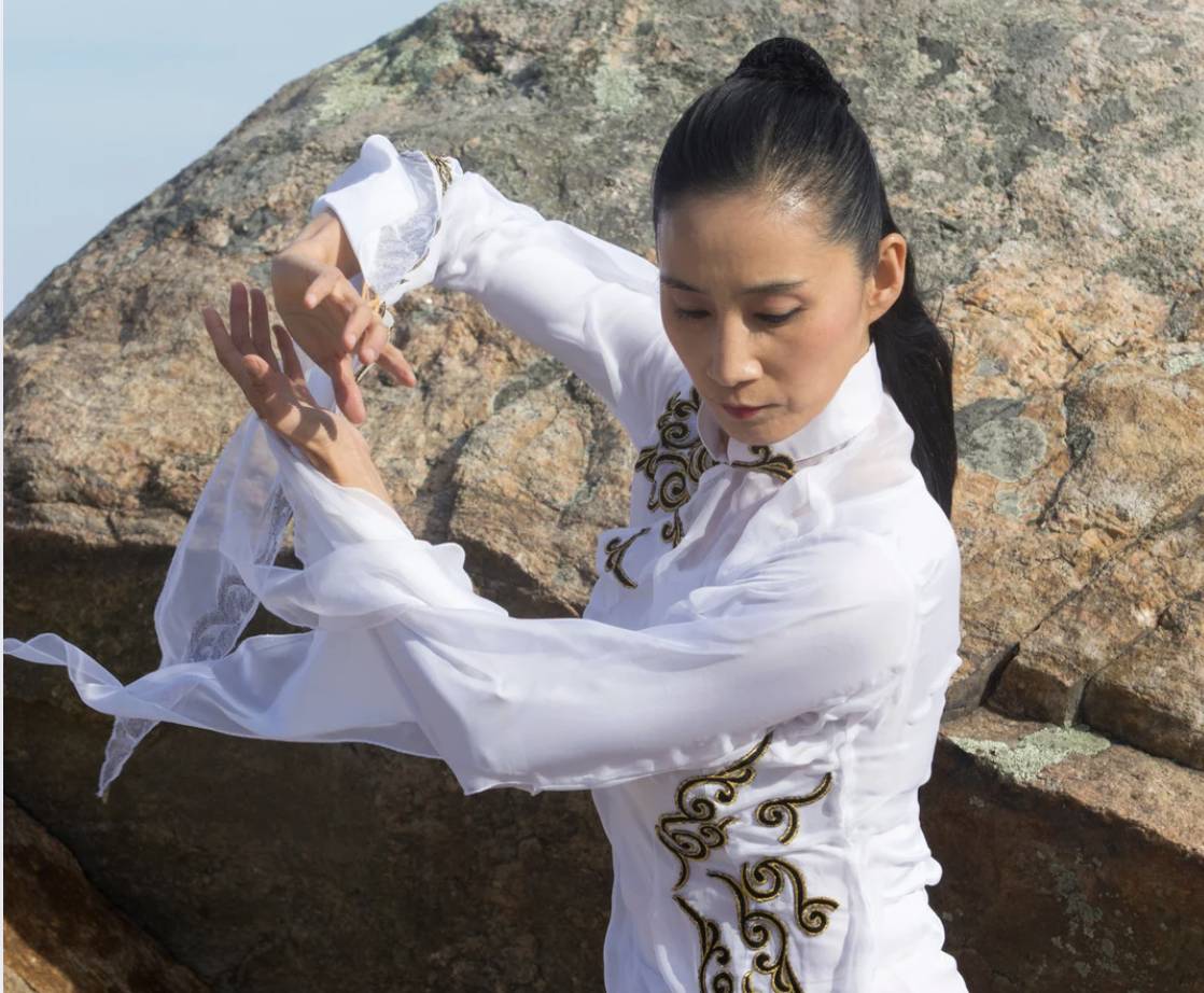 Chinese woman practicing qi gong outdoor